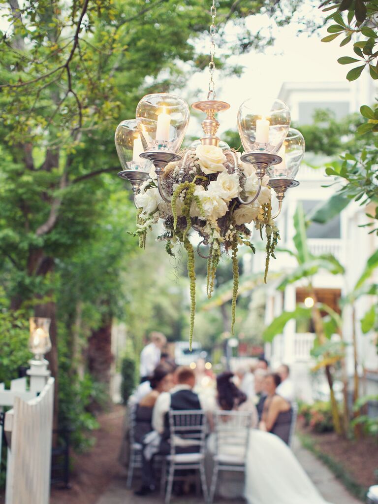 Floral chandelier at backyard wedding