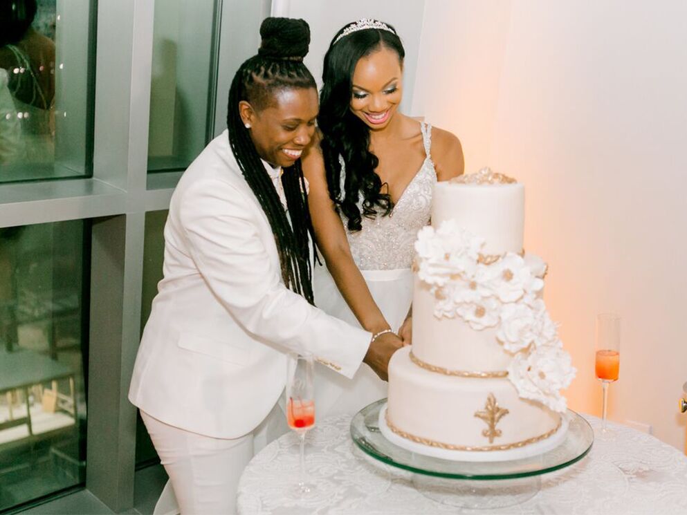 Couple cutting wedding cake