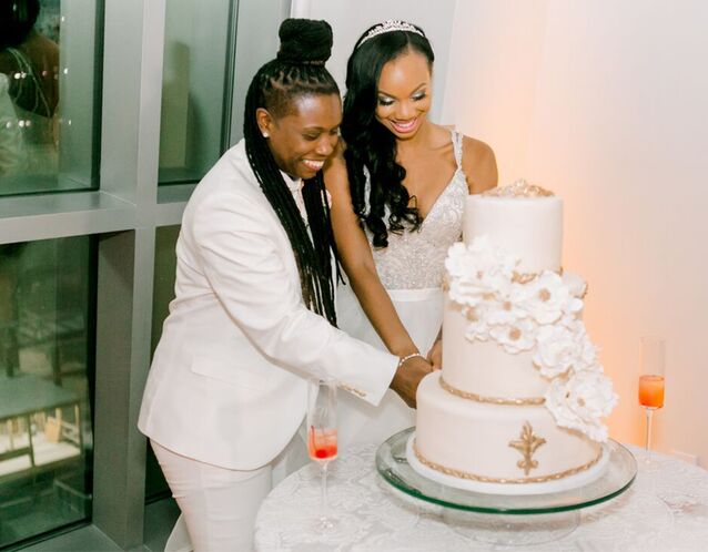 Couple cutting wedding cake