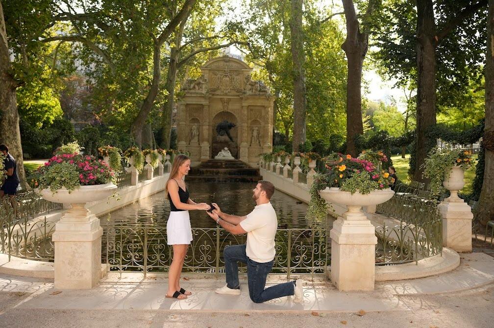 Zac proposes to Austin at the Jardin du Luxembourg in Paris, France. 