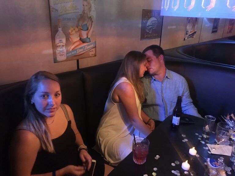 The first night we met, sounds cheesy but it was love at first sight -as you can see from the picture. Peep Sarah (one of the bridesmaids) looking at the photographer (my boss.. its a whole story). Burbon Cowboy, Emporia KS.