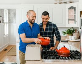 Couple opening wedding registry gifts at home