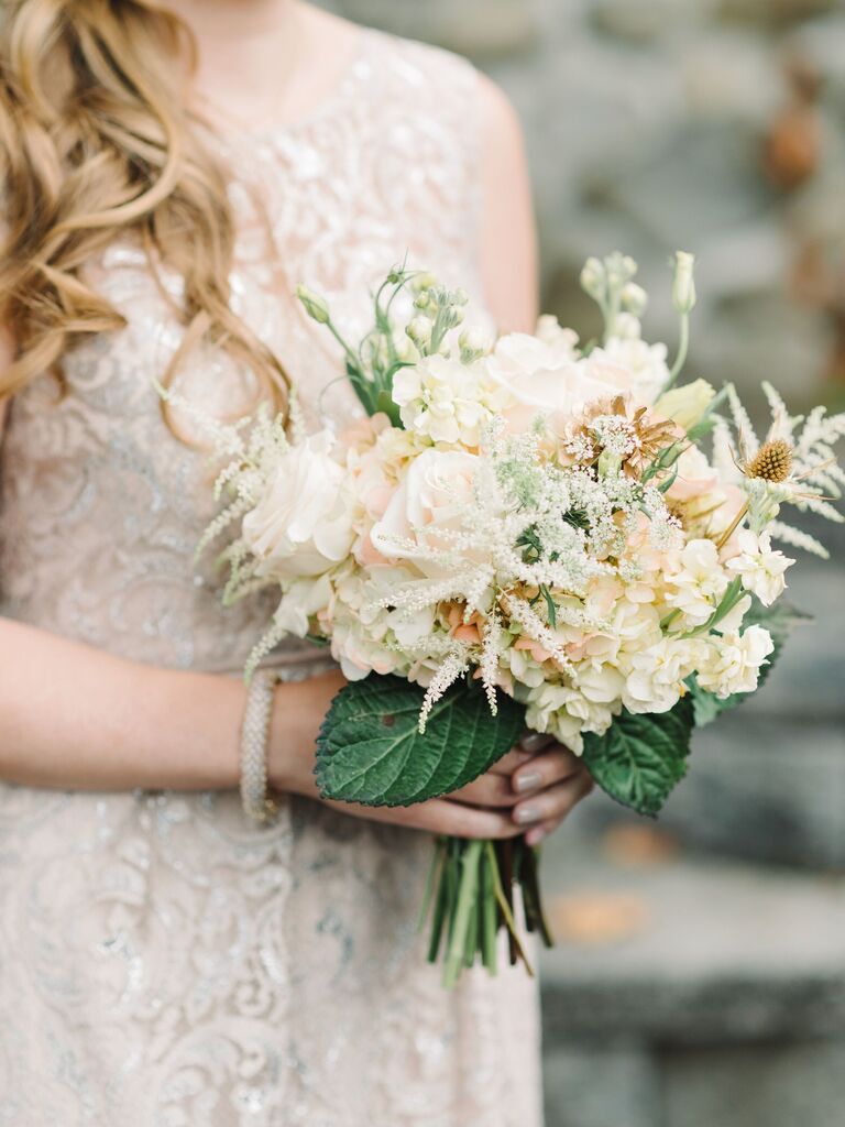 This bouquet is boho-chic, with off-white roses and sprays of wild flowers.