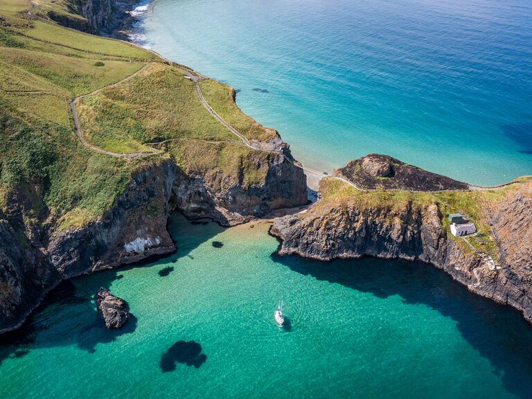 UK, Northern Ireland, County Antrim, Ballintoy, Carrick-a-Rede Rope Bridge, Aerial Drone view