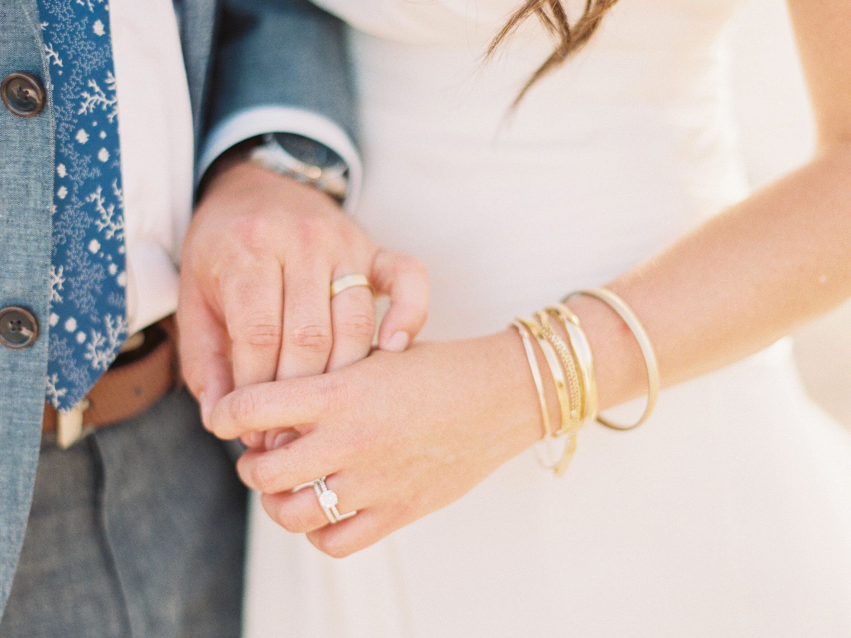 Bride and groom holding hands