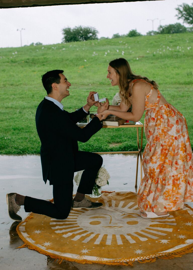 This is THE MOMENT I got to ask Ryann to marry me!!! It was thunderstorming heavily that morning but I couldn't have asked for a more perfect day. All of our friends and family did SO much work behind the scenes to make this special moment happen. Honestly the rain made it so Ryann had zero clue it was happening that morning. The look on her face when I showed up to her car door with an umbrella is my most precious memory from that day. I watched as she went from confused to understanding what was happening... and I immediately started crying. Just remembering this morning makes me so dang happy!!!  -Adam

The most precious moment. I will always remember screaming 1000% yes!!!!!! -Ryann 