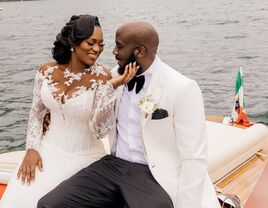 Bride and groom smiling at each other on boat wedding venue