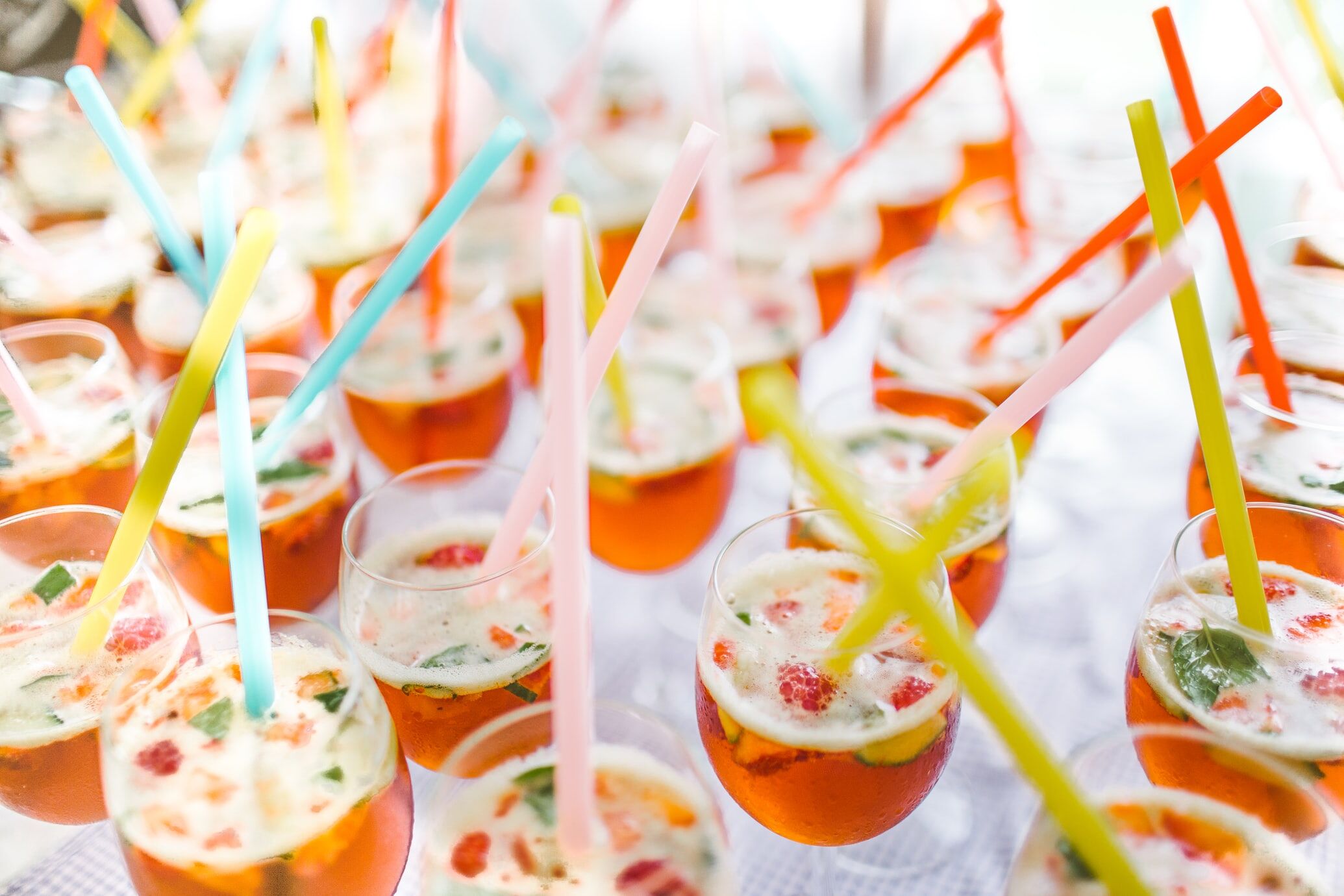 Cocktails with colorful straws