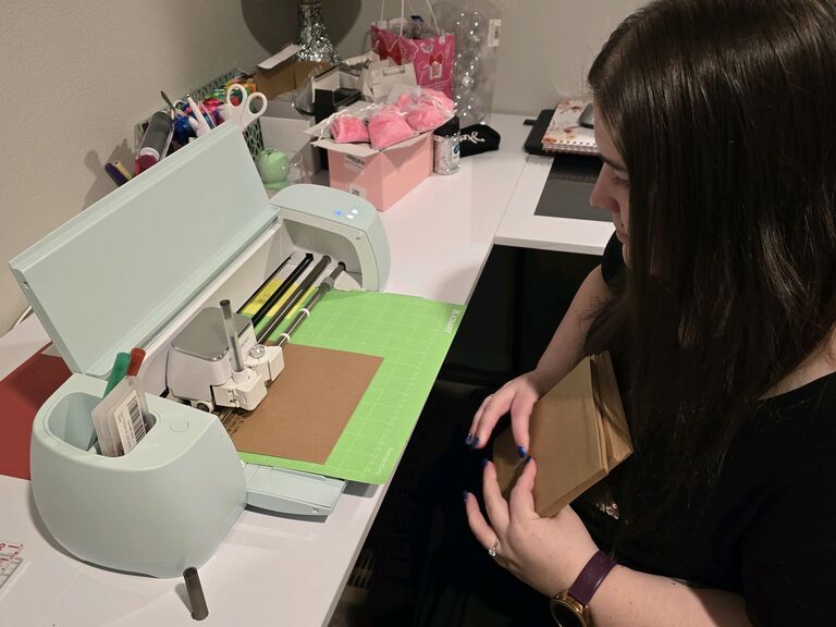 Shelby puts her Cricut skills to work, personally crafting all the Save the Date envelopes. Each name and address are carefully and robotically written.