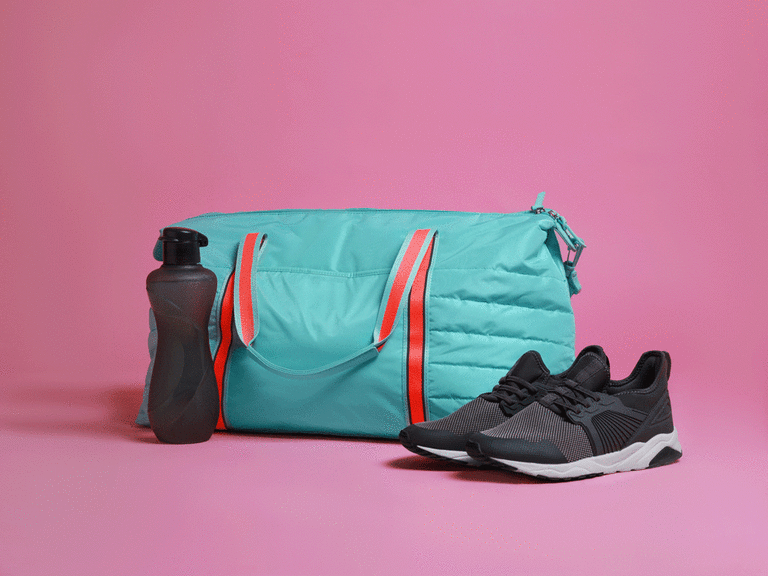 Exercise bag with water bottle and running shoes