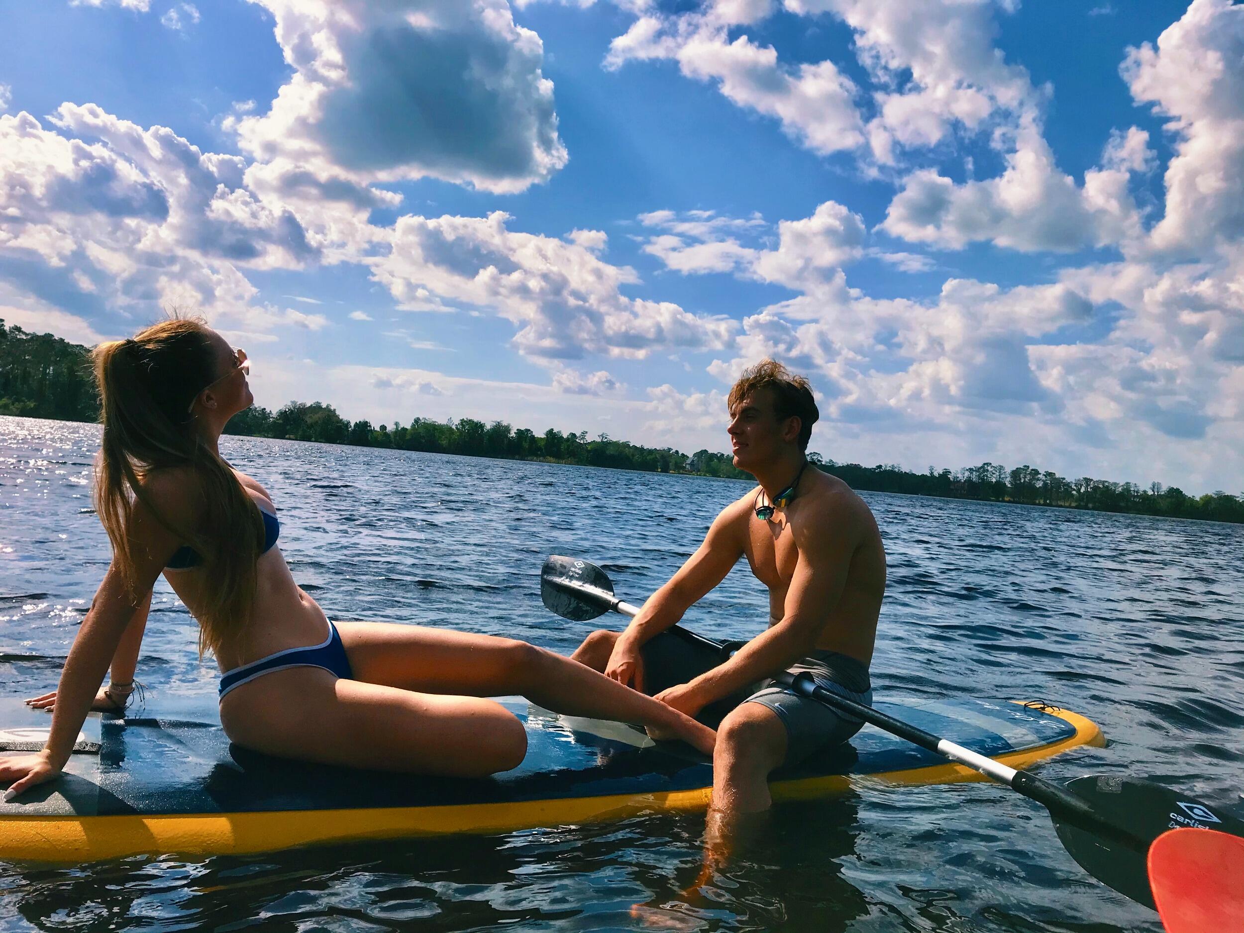 Emma and Brett out on the paddle board on Emma's lake!