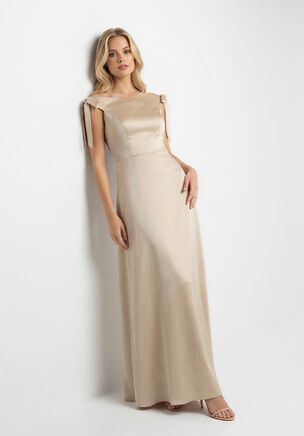 This A-line bridesmaid dress in Marquis Satin is romantic, classic, and full of youthful charm. The Sabrina neckline and delicate bows at the shoulders add a flirty, playful touch, while the flowing skirt keeps the silhouette elegant and flattering. Perfect for bridesmaids who want a timeless look with a fresh, modern vibe.