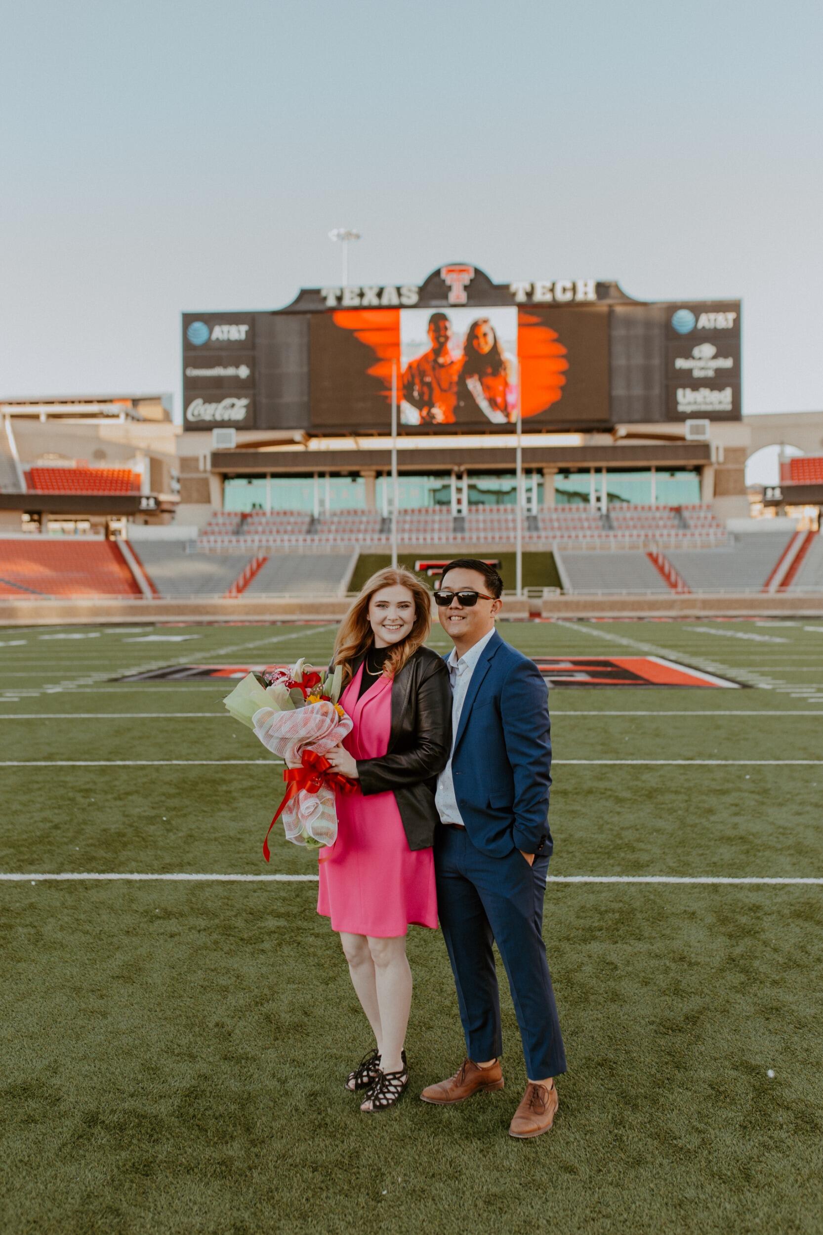 John and Savanna get engaged on the field of the Texas Tech Football Stadium, embraced by the loving support of friends and family.
