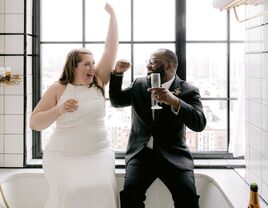 Bride and groom cheering