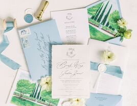 Wedding flatlay of accessories including stationery, flowers and details