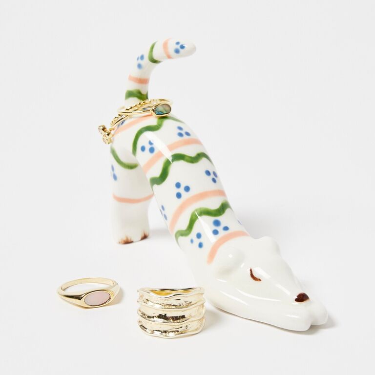 A ceramic ring holder shaped like a stretching dog from Oliver Bonas