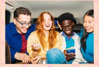 Friends laughing together in car