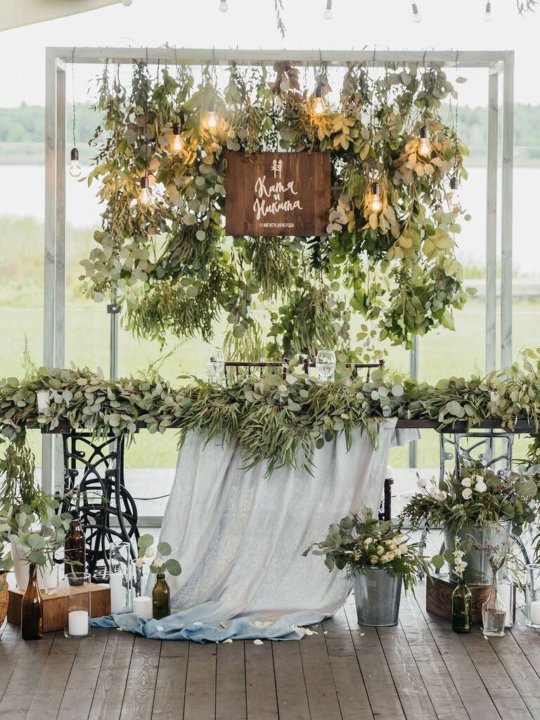 rustic wood sign and sweetheart table décor