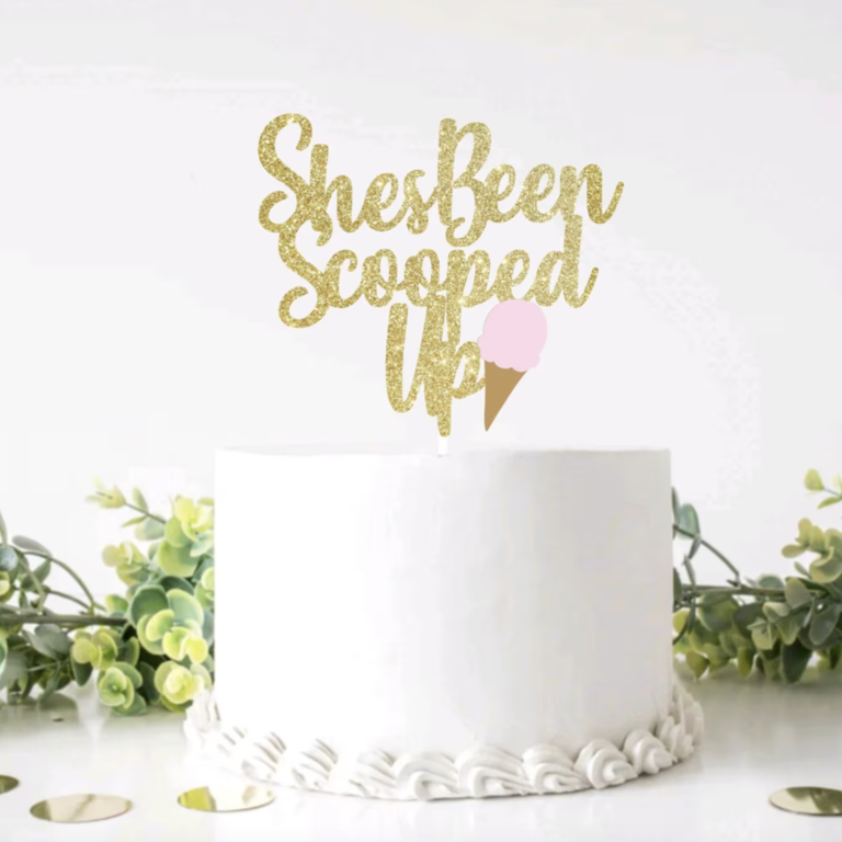 'She's been scooped up' gold bridal shower cake topper