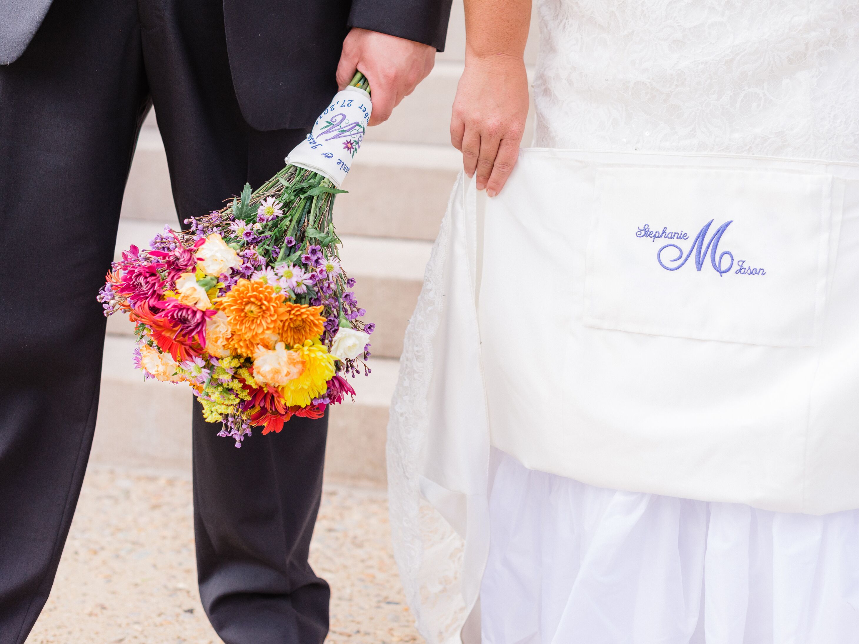 Bride with monogrammed wedding dress