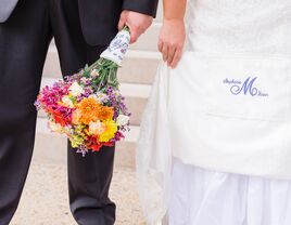 Bride with monogrammed wedding dress