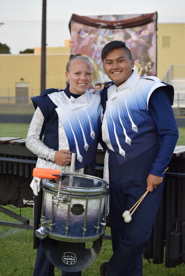 Kai and Anna march River City Rhythm Drum and Bugle Corps together