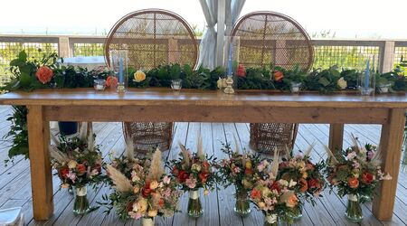 Babies breath and twine boutonniere Lighthouse Flower Shop