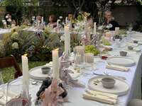 Pastel bow candle centerpiece at wedding