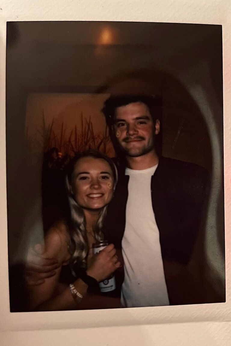 The first picture Ben and Katie took together! This was about 2 weeks after their first date (if you don't know how they met, ask them! It's quite a story). Katie's bridesmaid, Alex, took this on her Polaroid camera. Katie got COVID this night, and was down for the count for a few months after this. Katie told Ben that she wasn't in the right spot to start a new relationship due to being so ill. Ben assured Katie he was going to be there for her no matter what, and had no problem supporting her through her health struggles.