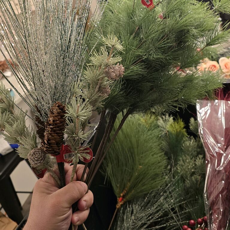 Shelby and Josh took full advantage of Hobby Lobby’s winter clearance, stocking up on décor to help bring their wedding vision to life. With several large totes filled to the brim, they gathered everything from table accents to materials for the wedding arch—laying the groundwork for some truly special signature pieces on the big day.