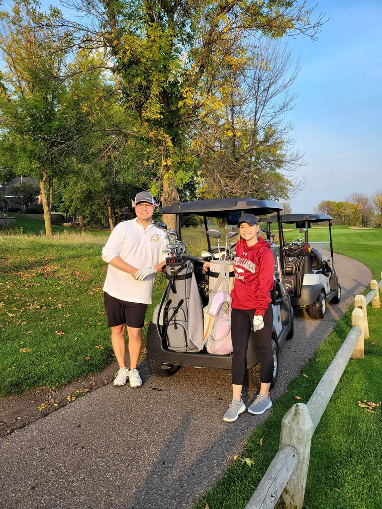 Golfing together in a couple's golf night!