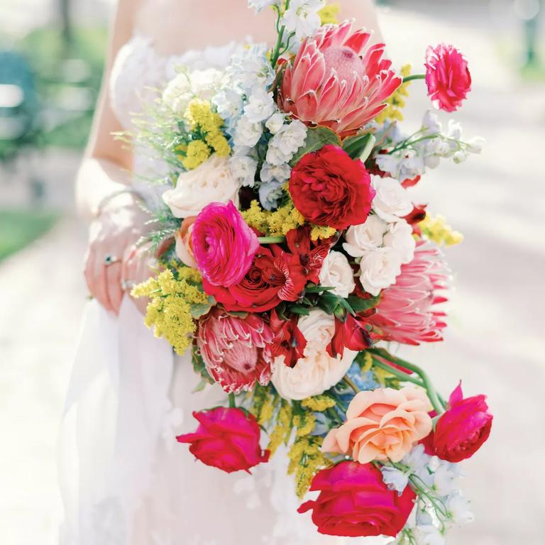 Bright pink protea and rose wedding bouquet