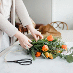 Woman creating wedding bouquet