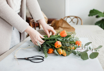 Woman creating wedding bouquet