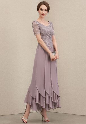 Attend the occasion in style in this chic and contemporary mother of the bride dress, featuring an eye-catching bodice that is accented by vibrant lace applique. The dramatic ruffle hem gives emphasis to the airy ankle-length chiffon skirt, that’s meant for twirling the night away.