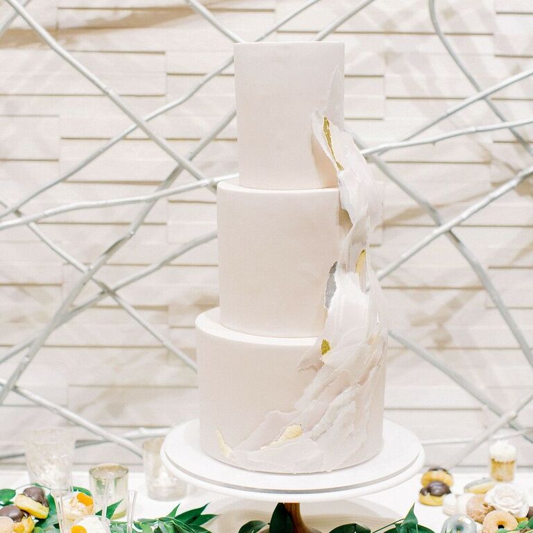 Modern three-tier wedding cake with ruffles