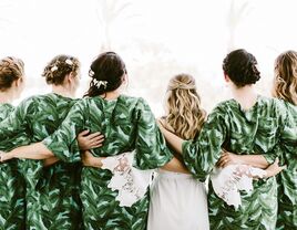 Bride with bridesmaids after getting hair done