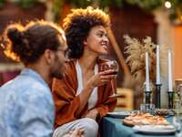 Couple dining outdoors with outdoor wedding registry items