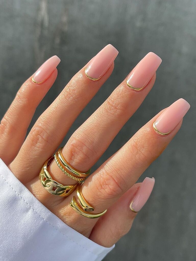 Pink nails with gold accents