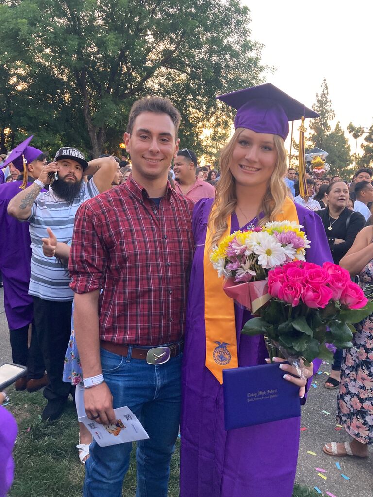 Dylan supports Kate by going to her High School graduation