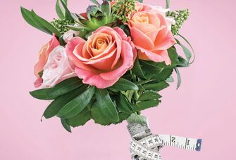 bouquet with measuring tape why we dont believe in the wedding diet by the knot editors 2024 planning issue