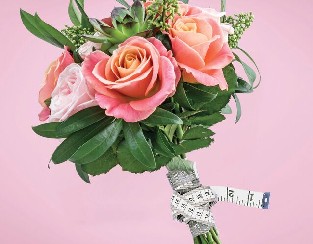 bouquet with measuring tape why we dont believe in the wedding diet by the knot editors 2024 planning issue