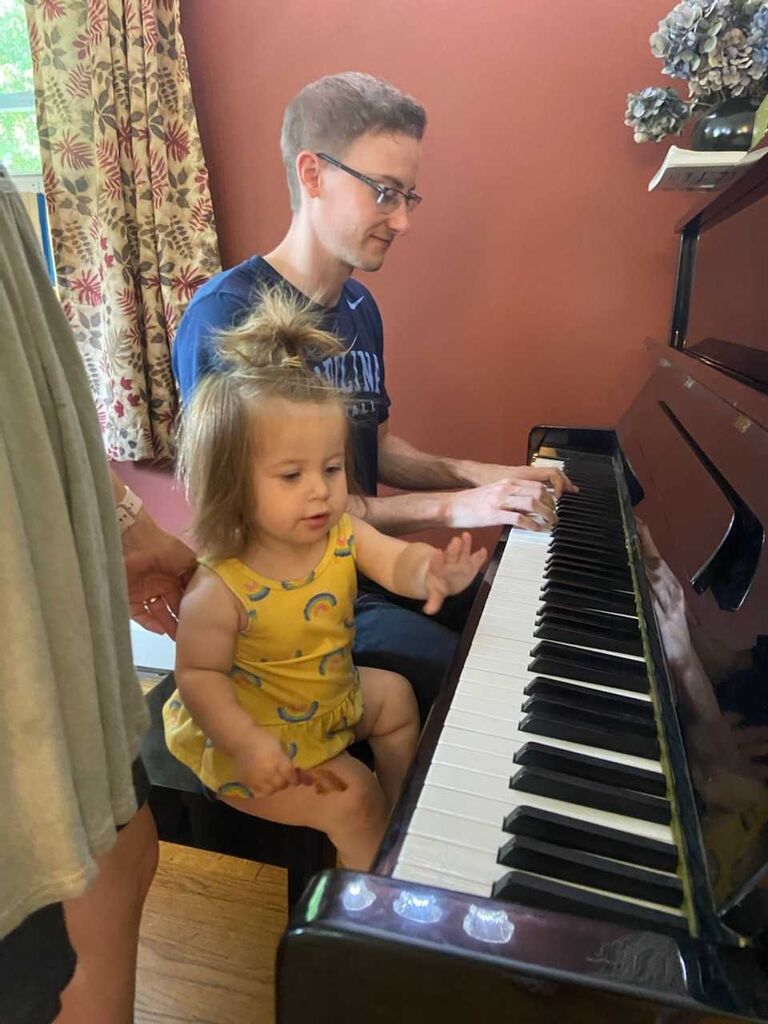 Matt teaching Ellie, my niece, how to play piano.
