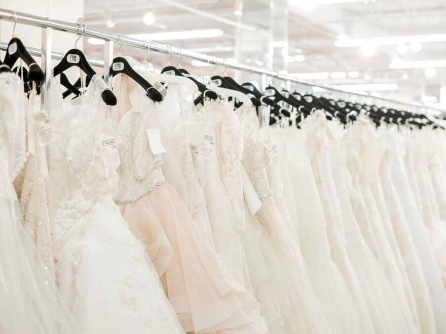 Row of wedding gowns at Dallas bridal dress shop Terry Costa