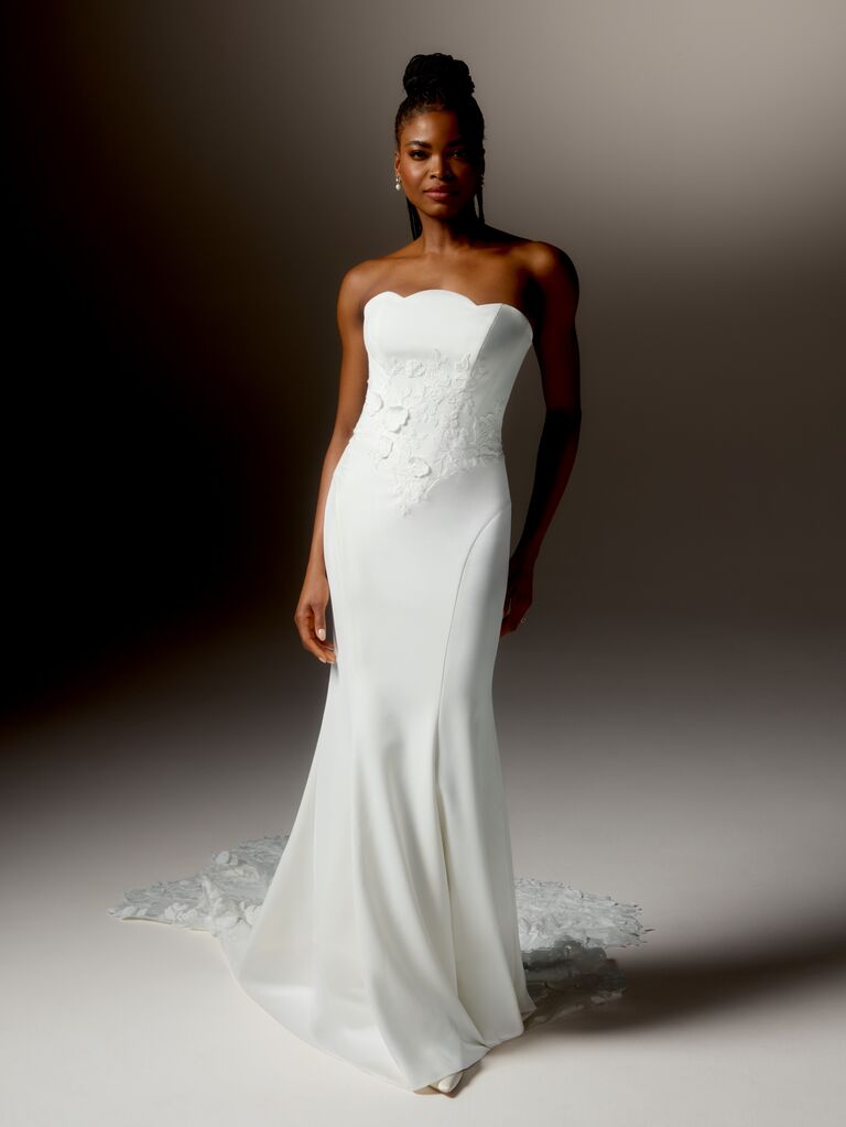 Slim fit wedding dress with floral lace bodice and strapless scalloped neckline by Justin Alexander