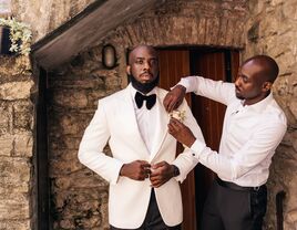 A groom and his best man prepare for the big day.