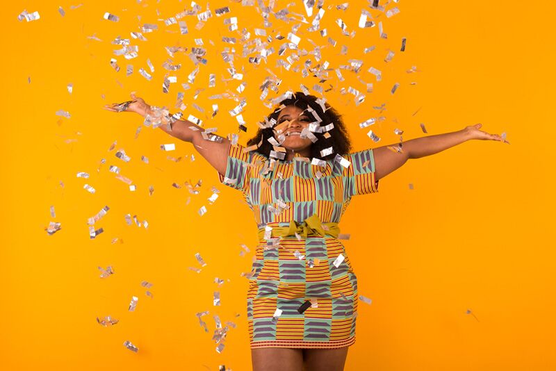 girl throwing glitter for photo opportunity