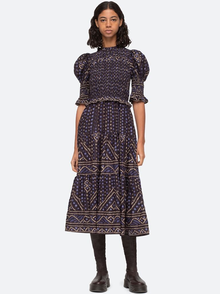 A navy and gold patterned smock dress with ouff sleeves and ruffle trim detailing from Sea New York