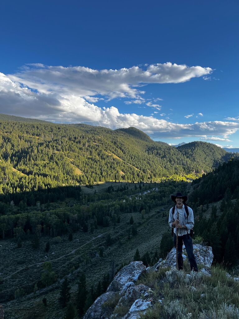 Driving around the outside of Teton National Park, they found a secluded spot to go fly fishing. Chase insisted they must hike up the mountain in order to find the perfect fishing spot.