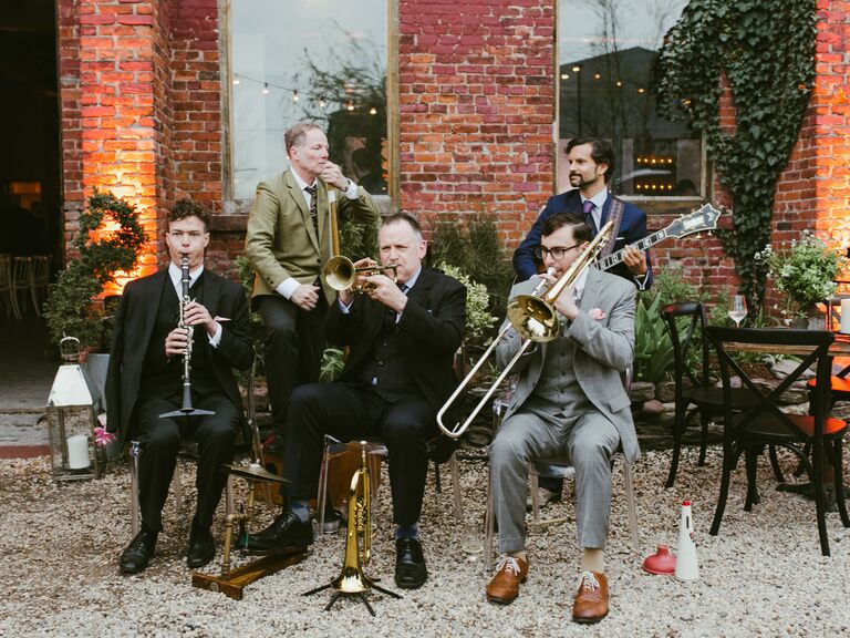A live jazz band playing at an outdoor reception. 